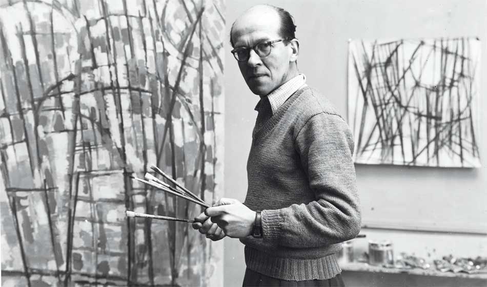 Jean Le Moal - Jean Le Moal dans son atelier rue Le Verrier à Paris, vers 1955, photographie John Craven, archives privées © Tous droits réservés